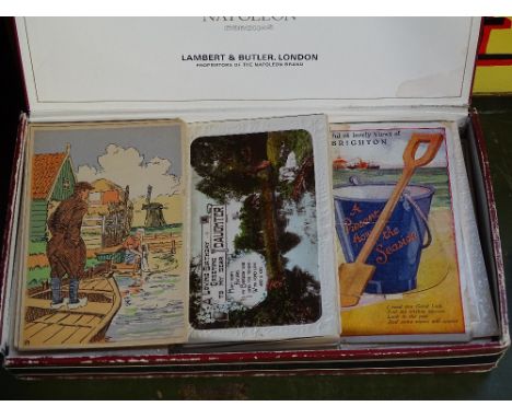 A box of Vintage postcards, including humerous 