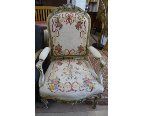 An Antique Continental cream painted and tapestry upholstered open-arm chair 