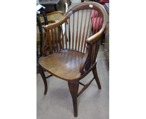 An Edwardian mahogany comb-back desk chair on turned legs 