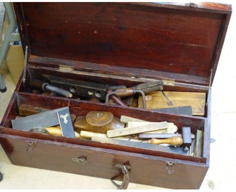 A wooden toolbox full of Vintage carpentry tools 
