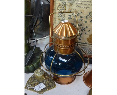 A group of mixed metalware, including a copper lamp with blue glass shade, and a Victorian brass table bell 