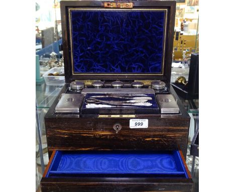 A Victorian Coromandel toilet set, complete with engine turned silver-topped toilet bottles, and a mother-of-pearl handled ma