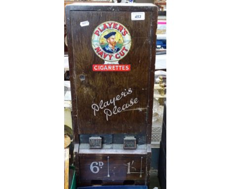 A Vintage wooden cigarette vending machine, advertising Player's Navy Cut cigarettes, with 2 drawers holding cigarettes for 6