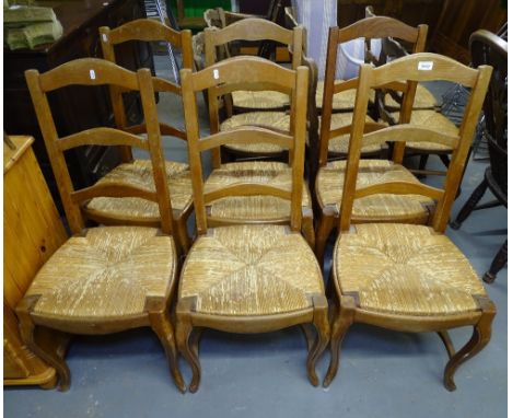 A set of 6 French beech ladder-back and rush-seated dining chairs 