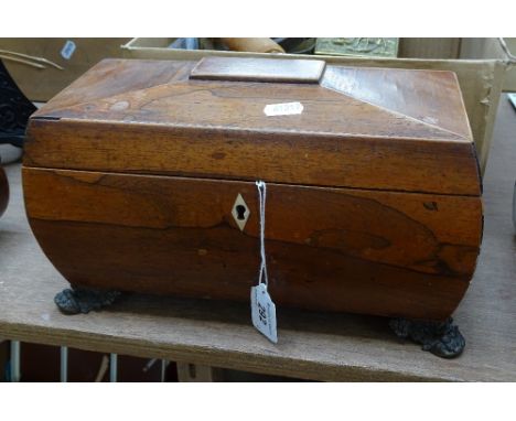 A 19th century rosewood tea caddy on brass feet, length 12" 