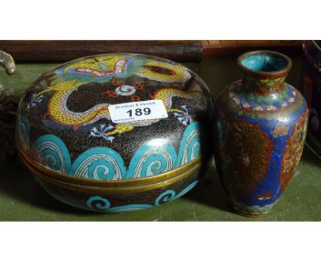 A Japanese cloisonne enamel circular box, 6" across, and an enamel vase (2) 