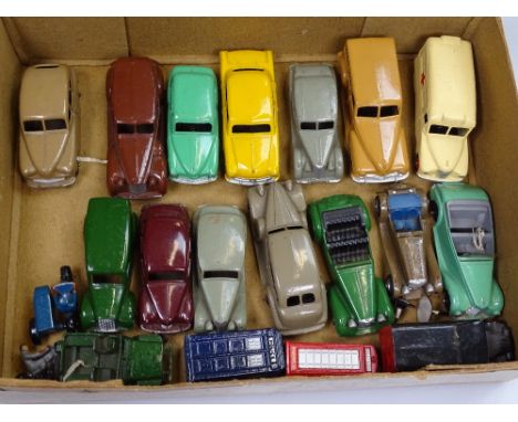 A collection of Vintage Dinky diecast vehicles, including Police Box and telephone box, Packard Buick, and Daimler ambulance 
