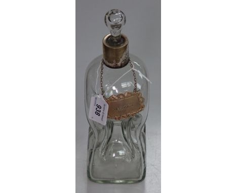 A glass claret jug of waisted form with plated mount, and 2 silver decanter labels 