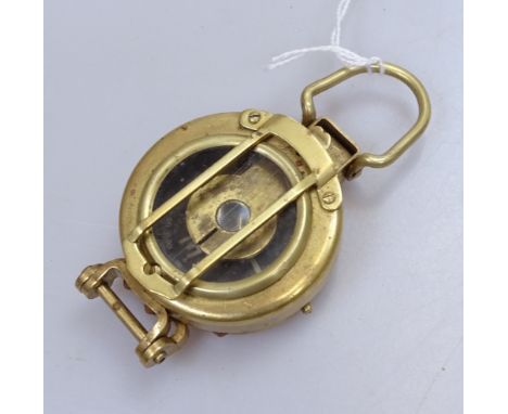 A brass-cased military Field compass, inscribed London 1920, diameter 2" 