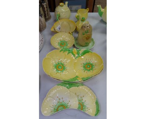 A small Carlton Ware buttercup teapot, sugar shaker, lemon squeezer, dishes etc,(10 pieces) 