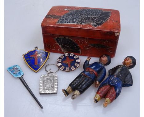A Japanese lacquered box, circa 1900, length 3", containing miniature figures, enamel badge etc 