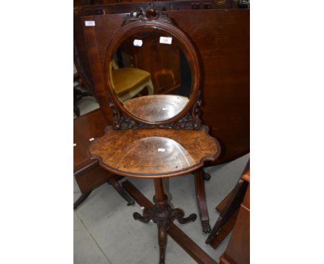 A very pretty Victorian walnut shaving or dressing stand having foliate decoration to mirror from, shaped shelf , turned colu