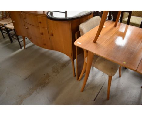 A vintage dining table, chairs and similar sideboard