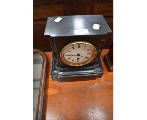 A Victorian black slate mantel clock of small proportions
