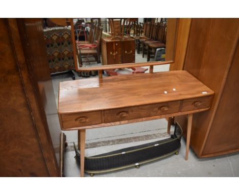 An Ercol mid or light stain dressing table, few light scuffs and scratches only, clean condition