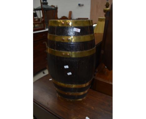 A period oak and brass bound barrel style stick stand