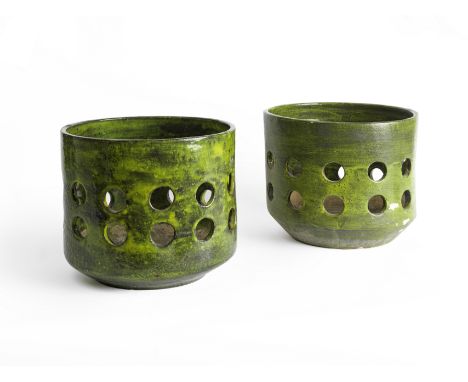 MADO JOLAINDeux cache-potscréation vers 1955Céramique émailléeH: 24cm.(9 7/16in.); D: 27cm.(10 5/8in.).A pair of enamelled ce