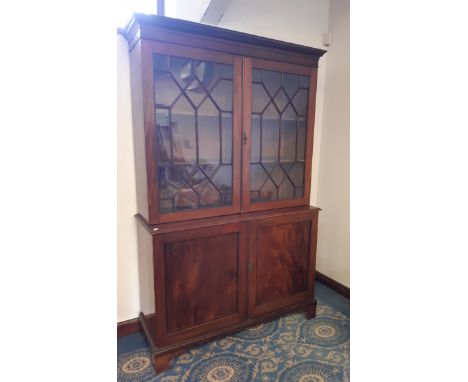 George III mahogany breakfront bookcase, dentil moulded cornice, upper part fitted two shelves enclosed by astragal glazed do