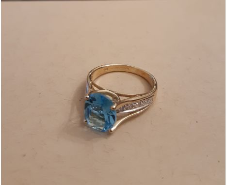 9ct gold blue topaz solitaire ring, approx 2ct, shank with diamond set shoulders, ring size M