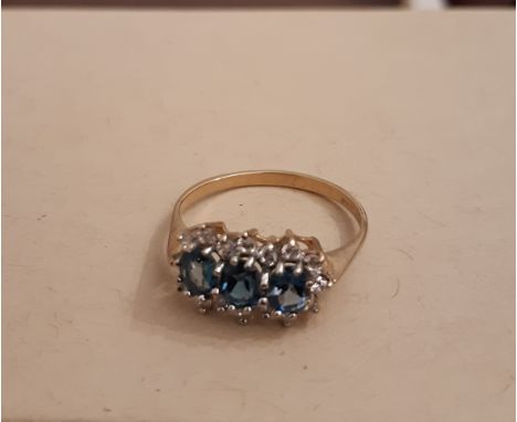 9ct gold blue and clear stone ring, set with three oval blue stones surrounded by small circular clear stone, ring size Q