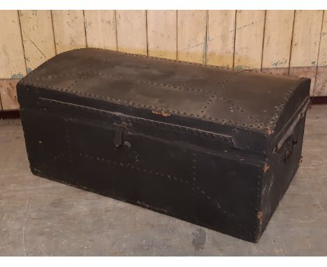 19th Century studded black canvas covered domed top trunk, 76cm wide x 43cm deep x 36cm high, slight damage