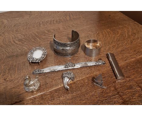 925 silver cornucopia, white metal cuff, silver comb mount and napkin ring and four other items