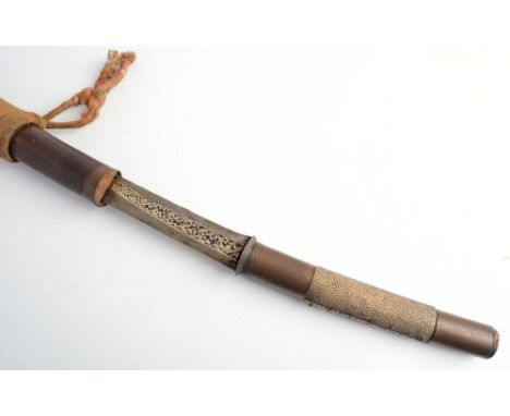 A 19th century Burmese Dha: the slightly curved blade  with niello style decoration to ricasso over a circular copper hilt an