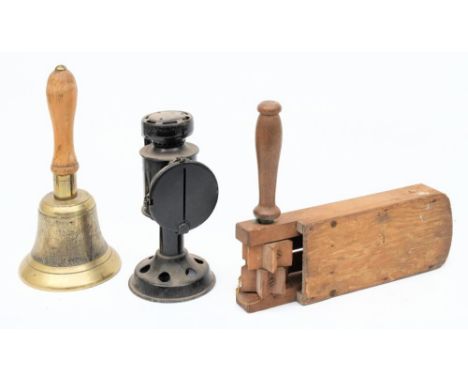 A WWII Fiddian ARP bell: with wooden handle, stamped 'JB39' to top of bell, together with a wooden gas rattle, and a post war