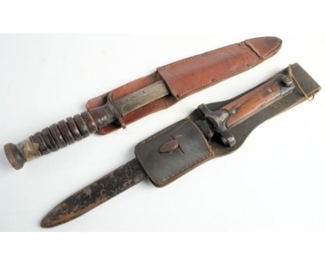 A WWII American M3 Utica fighting knife: clipped back blade stamped 'US M3 Utica' steel hilt and ribbed composite grip, in a 