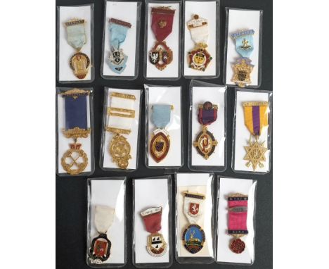 A group of Masonic gilt and enamel jewels: various lodges and dates including a Treasurer Breast badge for Wansborough Lodge 