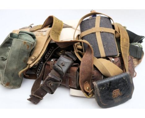 Two leather ammunition belts together with two Sam Browne belts and a collection of various canvas webbing etc: 