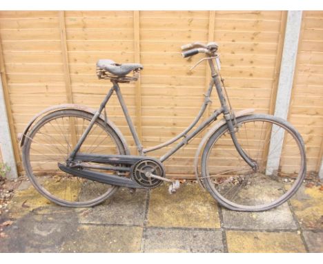 A 1927-28 James bicycle: step through frame with frame mounted Sturmey Archer three speed gears, plated handlebars with bar b
