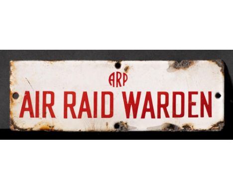 A WWII enamel door sign 'ARP. Air Raid Warden': red text on white ground, 7.6 x 22.7cm.