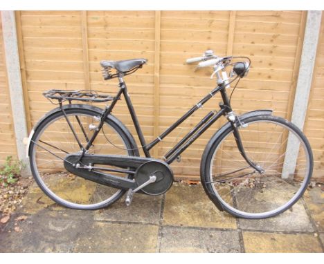 A 1950s Rudge Whitworth Sports bicycle: black step through frame with original decals, chrome  plated handle bars, Sturmey Ar