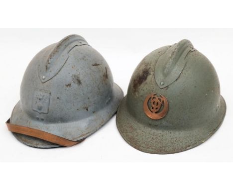 A WWII French Artillery M26 Adrian steel helmet: painted light blue with attached comb and helmet plate, together with one ot