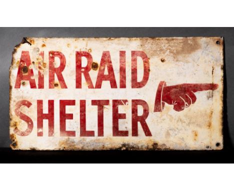 A WWII enamel 'Air Raid Shelter' sign:  with pointing hand, red on white ground, 25.5 x 48cm 