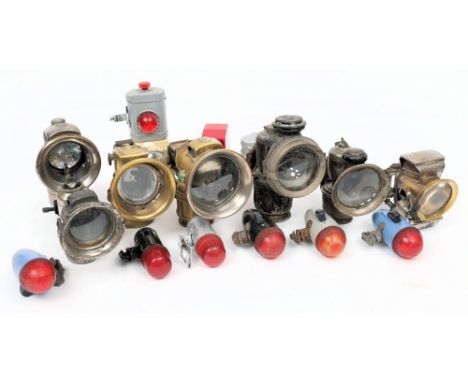 A group of seven various early 20th century bicycle lamps: including a Military lamp, a Lucas 'Aceta', a P&amp;H 'New Sultan'