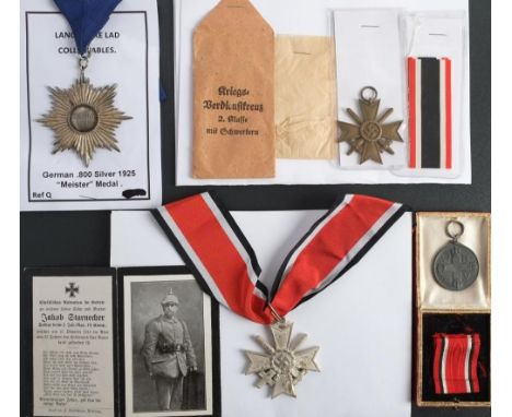 A German silver 'Meister' Star , 1925: together with a WWII Merit Cross with envelope of issue, a War Merit sash badge and a 