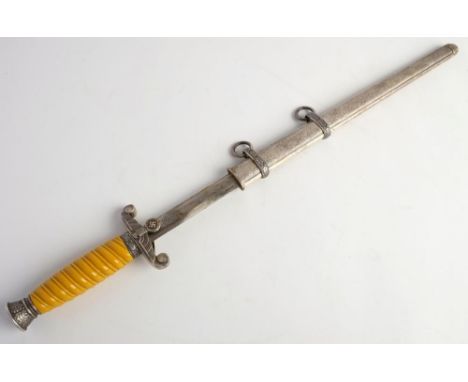 A reproduction  Luftwaffe dagger: the double edged blade over  eagle hilt and one piece grip with oak leaf decorated pommel, 
