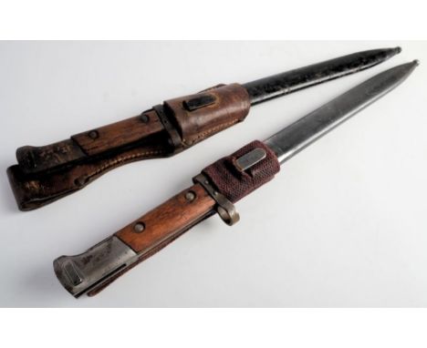 Two Czechoslovakian V224 pattern bayonets: both with two piece wooden grips in steel scabbards, both stamped 'E3 38 tgf'  to 