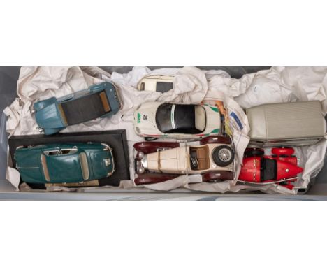 Solido, Burago and others. A group of unboxed large scale diecast vehicles: including an Aston Martin DB7, a Renault 2CV and 