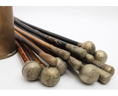 A group of thirteen various swagger sticks, military and other associations: including Birkenhead School, Royal Welsh, Army S