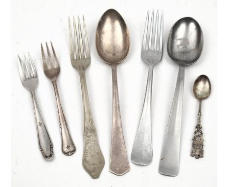 A group of WWII German mess cutlery: comprising a Kriegsmarine spoon, an SS Waffen fork, a Luftwaffe fork, a DAF spoon and tw