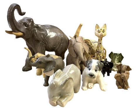 Group of ceramic and resin animal figures, mostly elephants, to include USSR model of a seated Terrier puppy, and a USSR mode