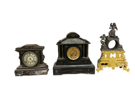An empty French mantle clock case with an American and French mantle clock