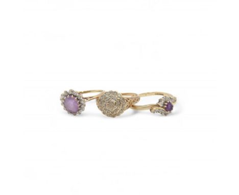 Two gold diamond set rings and an amethyst and cubic zirconia ring, all 9ctCondition Report: Approx 6.9gm, two diamond rings 