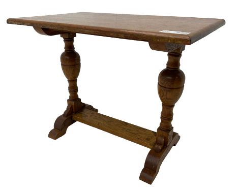 20th century oak occasional table, rectangular top on turned twin pillar supports, carved with squirrel motif, on shaped sled