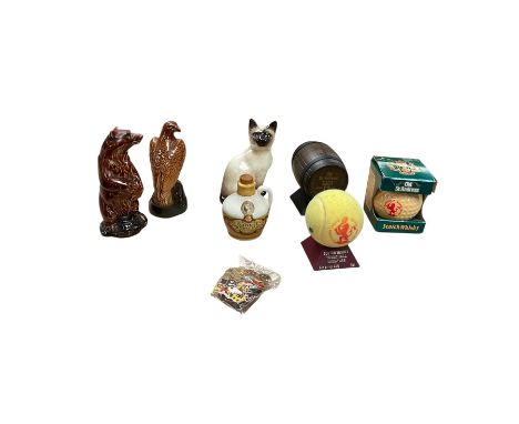 Six whisky miniatures in novelty decanters, together with Beswick cat, and nine Robertsons Golly badges Notice from the the-s