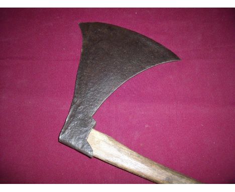 Extremely large iron bladed axe on short wood shaft (length of axe cutting edge 12 inches) 
