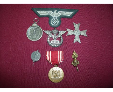 Group of mostly German related military badges, medals etc including cross, Winterschlacht Im Osten 1941-42 combat medal, Ger